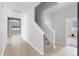 Inviting two-story foyer with neutral colors and tile floors at 4515 Fieldview Cir, Wesley Chapel, FL 33545