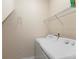 Laundry room equipped with a washer, dryer, and shelving for convenient storage at 4515 Fieldview Cir, Wesley Chapel, FL 33545