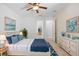 Bedroom with neutral walls, a ceiling fan, and an en-suite bathroom that offers comfort and convenience at 4515 Fieldview Cir, Wesley Chapel, FL 33545