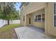 Back patio with concrete pavers and rear exterior of home at 4515 Fieldview Cir, Wesley Chapel, FL 33545