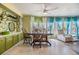 Charming dining area with colorful curtains and a view to the living room at 5350 Mohawk St, Zephyrhills, FL 33542