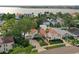 Estate home with a brick-paved driveway and manicured landscaping, nestled near tranquil waters at 54 Aegean Ave, Tampa, FL 33606