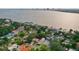 Picturesque neighborhood with tranquil water views, showcasing homes nestled among lush greenery at 54 Aegean Ave, Tampa, FL 33606