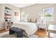 Comfortable bedroom with natural light, hardwood floors and decorative sports flags at 54 Aegean Ave, Tampa, FL 33606