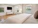 Sun-filled bedroom with hardwood floors and large windows at 54 Aegean Ave, Tampa, FL 33606