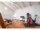Exercise room features high ceilings, wooden floors, and an array of workout equipment at 54 Aegean Ave, Tampa, FL 33606