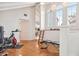 Spacious exercise room boasts bright windows, high ceilings, and exposed wooden floors at 54 Aegean Ave, Tampa, FL 33606
