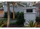Front exterior of a well-lit stucco home with mature landscaping and clear address marker at 54 Aegean Ave, Tampa, FL 33606