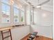 Bright workout space with arched windows, ceiling fan, wooden floors and gym equipment at 54 Aegean Ave, Tampa, FL 33606