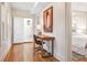 Hallway with desk, opening up to bathroom and bedroom spaces at 54 Aegean Ave, Tampa, FL 33606
