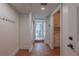 Hallway with terracotta floors leads to a courtyard and features white walls and cabinetry at 54 Aegean Ave, Tampa, FL 33606