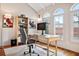 Bright home office with vaulted ceilings, modern desk, contemporary decor, and large windows at 54 Aegean Ave, Tampa, FL 33606