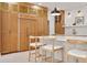 Kitchen with breakfast bar seating and oak cabinets and stainless appliances at 54 Aegean Ave, Tampa, FL 33606