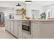 Kitchen island featuring stainless steel microwave and storage cabinets at 54 Aegean Ave, Tampa, FL 33606