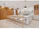 Modern kitchen featuring a large center island with seating, custom cabinetry, and sleek countertops, a chef's dream at 54 Aegean Ave, Tampa, FL 33606