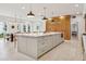 Large kitchen island with seating, marble countertop and modern appliances at 54 Aegean Ave, Tampa, FL 33606