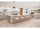Spacious kitchen with oversized island, light stone floors, and updated appliances at 54 Aegean Ave, Tampa, FL 33606