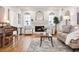 Stylish living room with hardwood floors, arched windows, fireplace, and comfortable seating, ideal for relaxation at 54 Aegean Ave, Tampa, FL 33606