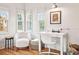 Sunlit home office featuring hardwood floors, large windows, and modern decor at 54 Aegean Ave, Tampa, FL 33606