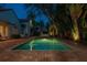 A secluded pool surrounded by lush tropical foliage that creates a personal retreat at 54 Aegean Ave, Tampa, FL 33606