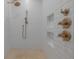 The frameless glass shower is tiled and features bronze hardware at 54 Aegean Ave, Tampa, FL 33606