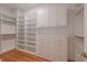 Organized walk-in closet with custom shelving, drawers, and ample storage space, ready for your wardrobe at 54 Aegean Ave, Tampa, FL 33606