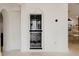Custom wine storage built into the wall with an arched design adds a touch of elegance to the space at 54 Aegean Ave, Tampa, FL 33606