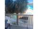 View from the balcony of the community with pool, palm trees, and mural at 5500 Gulf Blvd # 2229, St Pete Beach, FL 33706