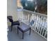 Cozy balcony with a chair and table offering a relaxing outdoor space at 5500 Gulf Blvd # 2229, St Pete Beach, FL 33706