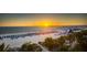 Beautiful beach sunset, rows of chairs and water slide features make a welcoming ocean front at 5500 Gulf Blvd # 2229, St Pete Beach, FL 33706