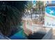 Beautiful community with a pool, bridge, and palm trees, creating a serene atmosphere at 5500 Gulf Blvd # 2229, St Pete Beach, FL 33706