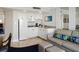 Efficient kitchen with sleek white cabinets, granite countertops, and comfortable seating at 5500 Gulf Blvd # 2229, St Pete Beach, FL 33706