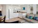 Efficient kitchen with sleek white cabinets, granite countertops, and comfortable seating at 5500 Gulf Blvd # 2229, St Pete Beach, FL 33706