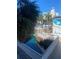 Lush landscaping and outdoor pool area with pedestrian bridge at 5500 Gulf Blvd # 2229, St Pete Beach, FL 33706