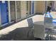Outdoor patio space with a table, chairs, and views of the community at 5500 Gulf Blvd # 2229, St Pete Beach, FL 33706