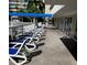 Rows of lounge chairs on the community pool deck, perfect for relaxation and sunbathing at 5500 Gulf Blvd # 2229, St Pete Beach, FL 33706