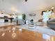 Bright living room featuring wood floors, modern furnishings, and an open floor plan at 5702 War Admiral Dr, Wesley Chapel, FL 33544