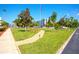 Community park with manicured landscaping, park benches, and pedestrian pathways at 5935 30Th S Ave # 204, Gulfport, FL 33707