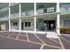 Building entrance with covered parking and elevator access, ensuring convenience and accessibility for residents at 5935 30Th S Ave # 204, Gulfport, FL 33707