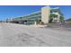 An inviting condominium exterior featuring convenient covered parking and lush landscaping at 5935 30Th S Ave # 204, Gulfport, FL 33707