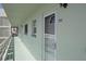 Exterior of a unit showcases a well-maintained entrance and serene walkway at 5935 30Th S Ave # 204, Gulfport, FL 33707