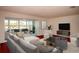 Spacious living room featuring comfortable seating, modern decor, sliding glass doors, and access to the patio at 5935 30Th S Ave # 204, Gulfport, FL 33707