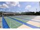 Multiple outdoor shuffleboard courts with the city buildings in the distance at 5935 30Th S Ave # 204, Gulfport, FL 33707