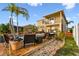 A spacious backyard features an outdoor seating area, pool, and patio, great for relaxing or entertaining guests at 6239 French Creek Ct, Ellenton, FL 34222