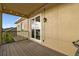 Outdoor patio with decorative lighting, sliding glass doors, and a view of the neighborhood at 6239 French Creek Ct, Ellenton, FL 34222