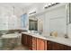 Bright bathroom with soaking tub, dual sink vanity, and decorative chandelier at 6239 French Creek Ct, Ellenton, FL 34222