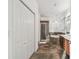 Hallway leading to a bathroom with a double vanity, stand alone tub, and walk in shower at 6239 French Creek Ct, Ellenton, FL 34222