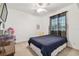 Bright bedroom features a neutral palette, ceiling fan, and a window with shades at 6239 French Creek Ct, Ellenton, FL 34222