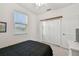 Bright bedroom features a neutral palette, ceiling fan, and a large closet with a shelf above at 6239 French Creek Ct, Ellenton, FL 34222
