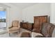 Bedroom with hardwood furniture and a sliding glass door leading to an outdoor patio with a scenic view at 6239 French Creek Ct, Ellenton, FL 34222